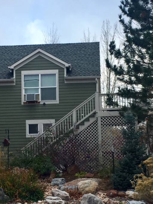 side of house showing stairs leading up to apt