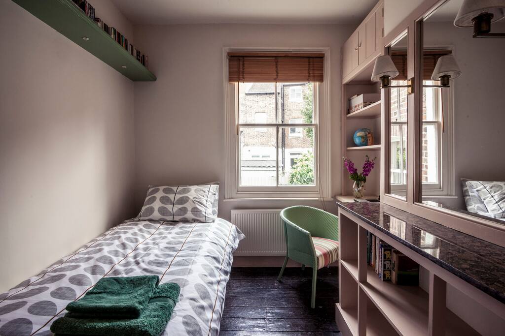 The single bedroom, overlooking the garden.