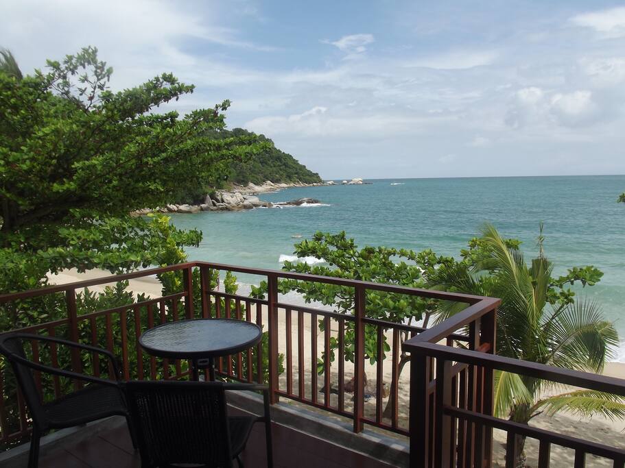 White room. Outdoor coffee/ dining table with the ocean view.