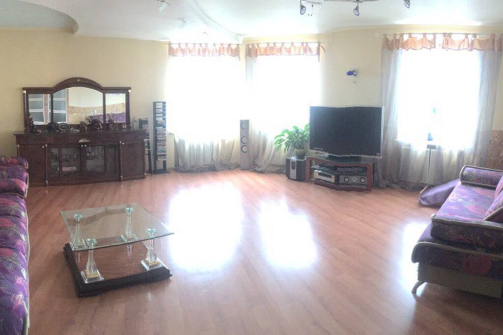 A large room with big TV
