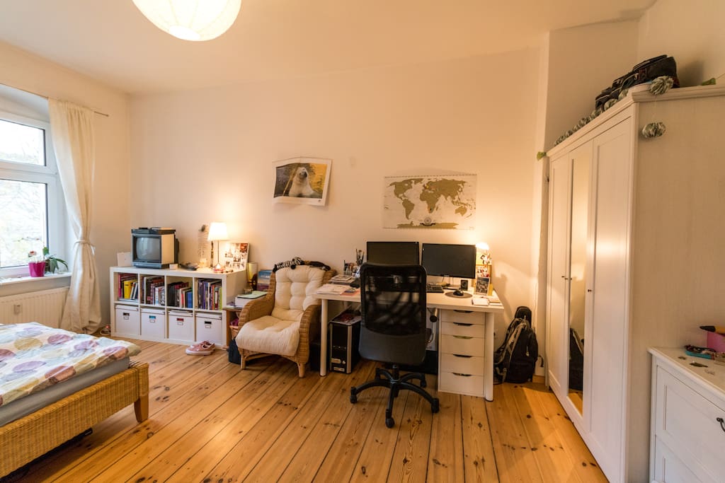 The bedroom with desktop and closet