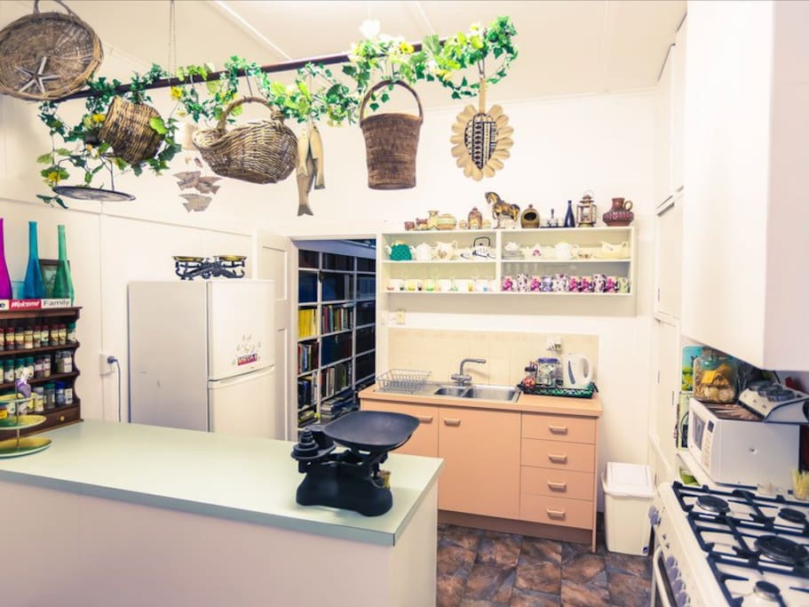 The country kitchen has a large oven, fully stocked pantry and fridge.