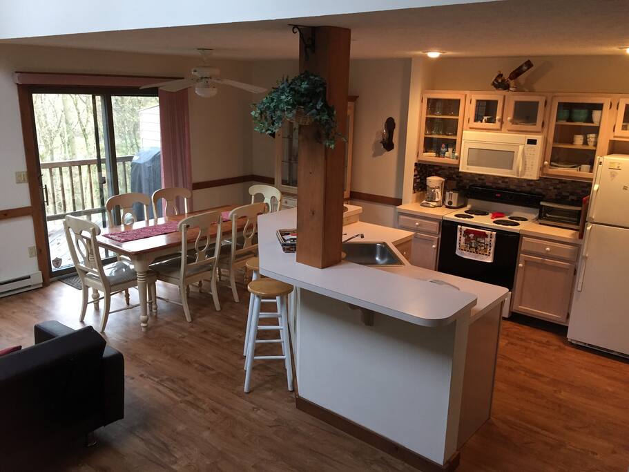 Sliding doors off dining room leads to deck w/outdoor gas grill and sitting area