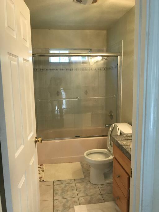 bathroom next to bedroom