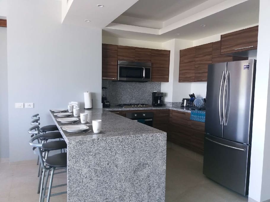Modern kitchen with breakfast bar.