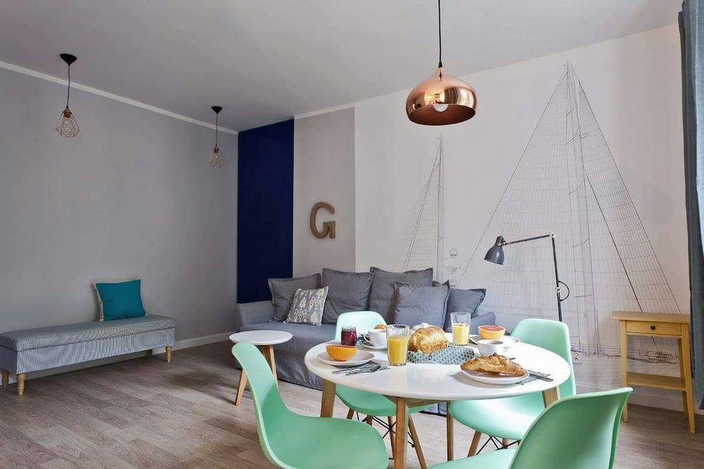 Spacious leaving room with sofa bed, TV and dining table for 4.