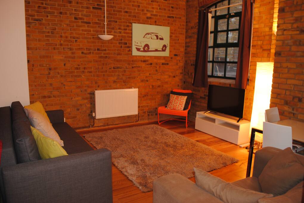 Old warehouse conversion with 3 seater sofa bed