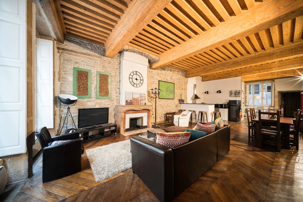Wooden floor and high beamed ceiling are original.