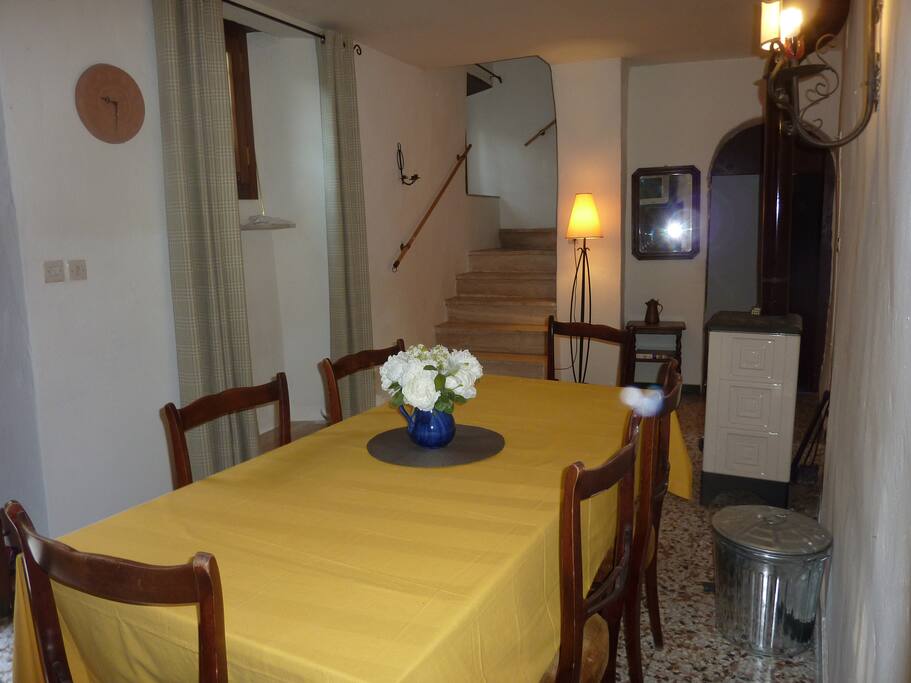 The dining room lead to the bedrooms upstairs and connects to the downstairs apt