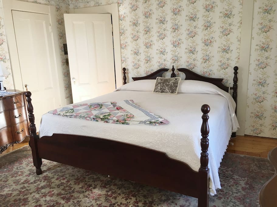 The Sherman Room - A sunny room with a King sized bed, two dressers and a cozy fireplace.
