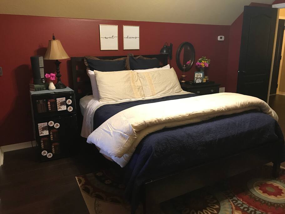 Queen size bed and mini fridge