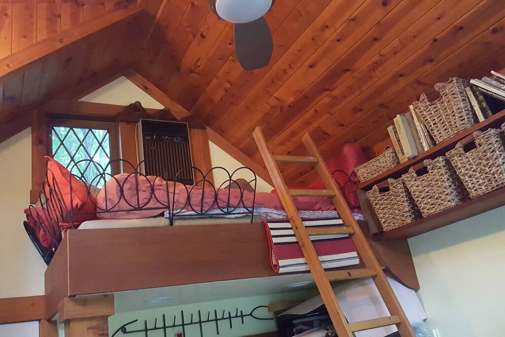 The loft sleeps one, comfortably and has great access to books. The perfect reading nook.