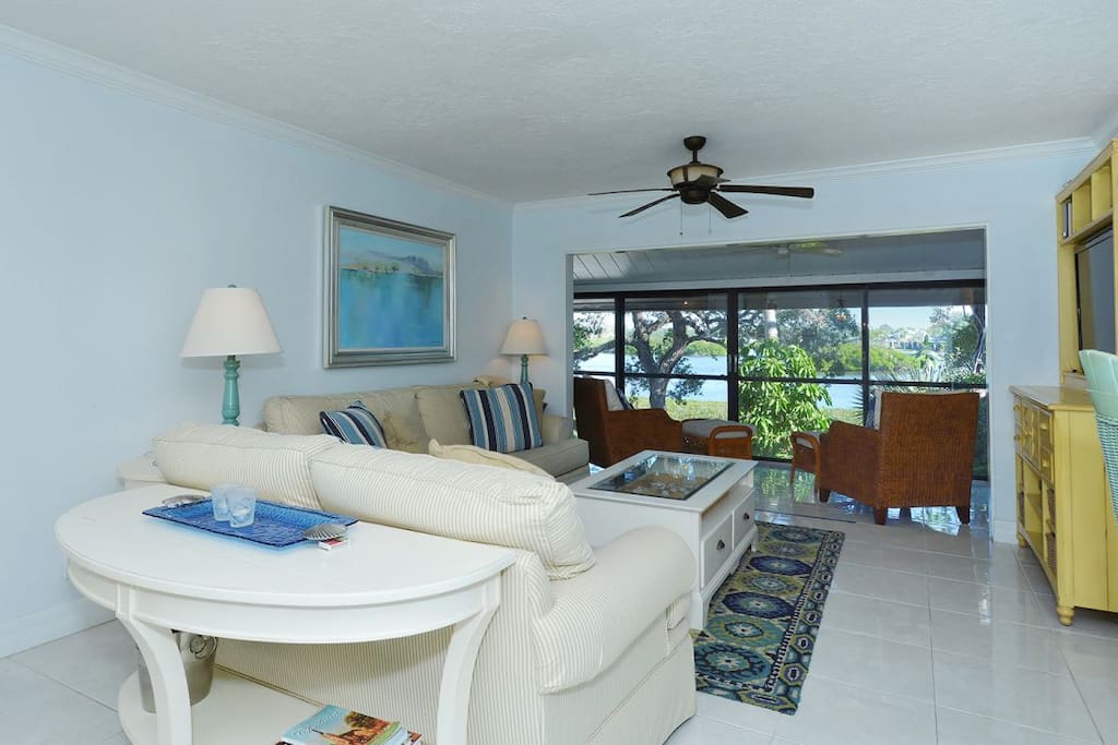 View from dining area, looking through living room and out the lanai.
