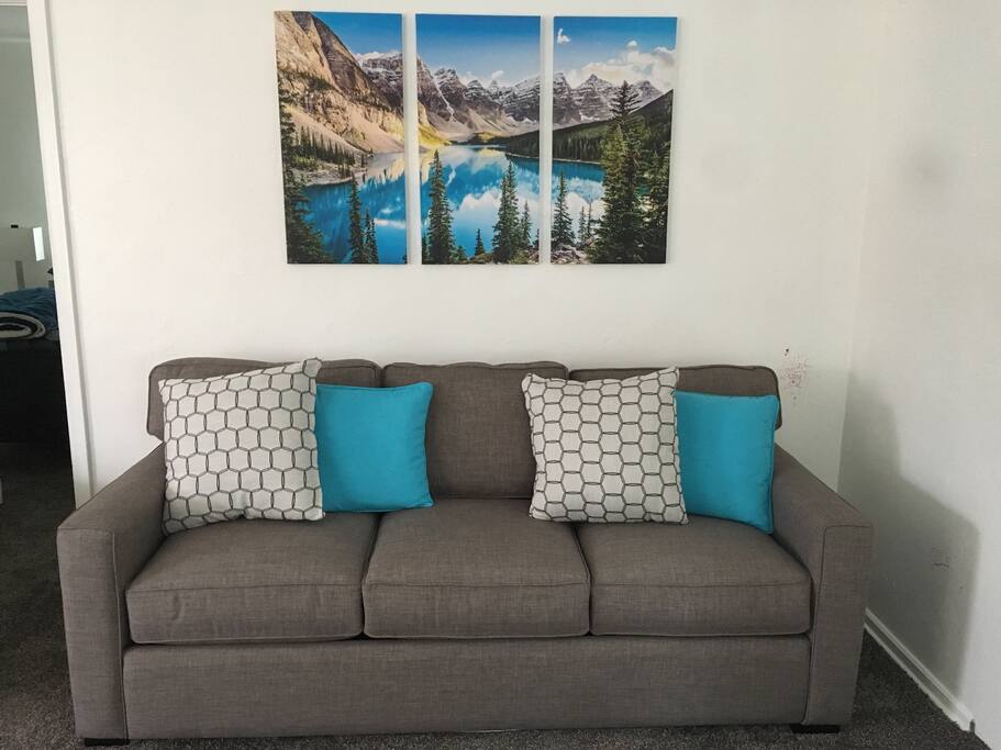 Sofa bed with comfortable memory foam mattress.