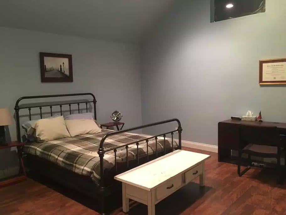 Airy upstairs bedroom with vaulted ceilings