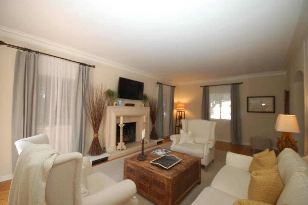 Step down living room with tall ceilings and tons of natural light.