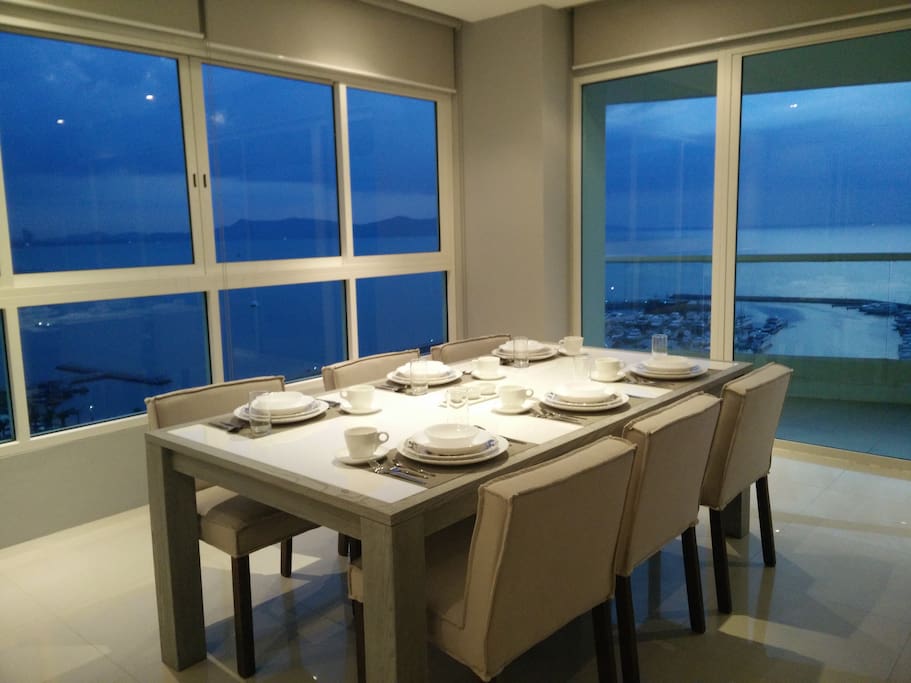 View of ocean and marina from living room and dining room. A beautiful sight.