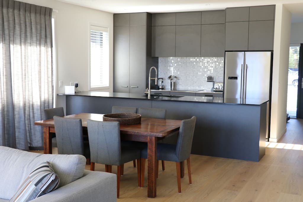 Kitchen/Dining with great in/outdoor flow to courtyard with a Weber Family Q BBQ