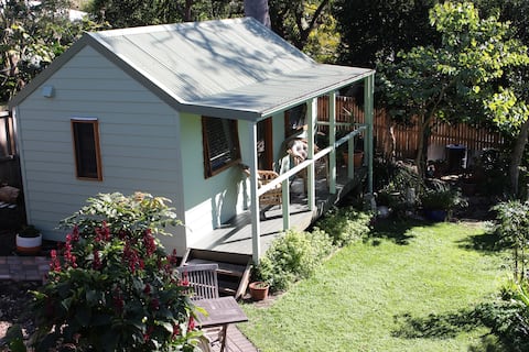 Relax on the sunny deck of the Comfortable Cabin.