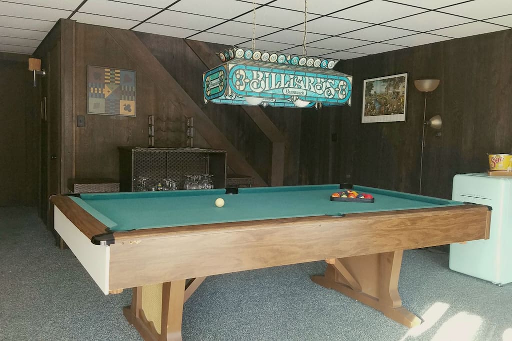 Pool table on first floor with mini fridge and board games!