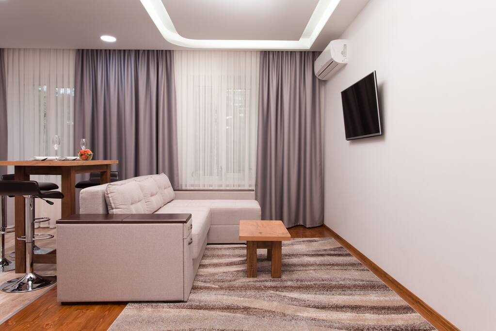 Spacious living room, with a nice pull out sofa in front of a big Full HD TV!