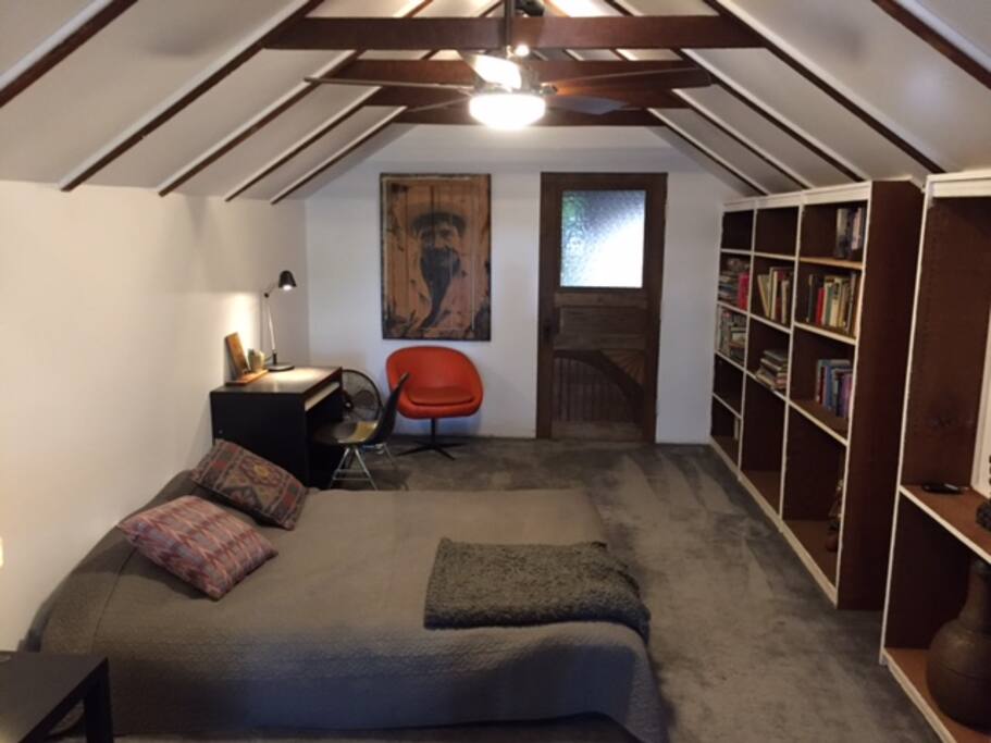 Queen sized bed with overhead fan