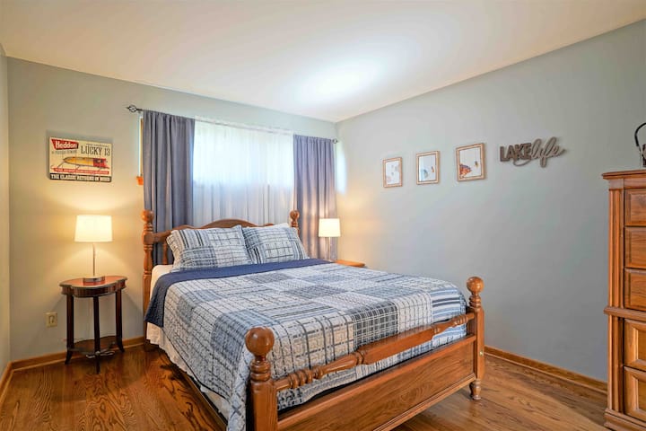 The Fishermen Room. Features a queen size bed and oscillating fan.