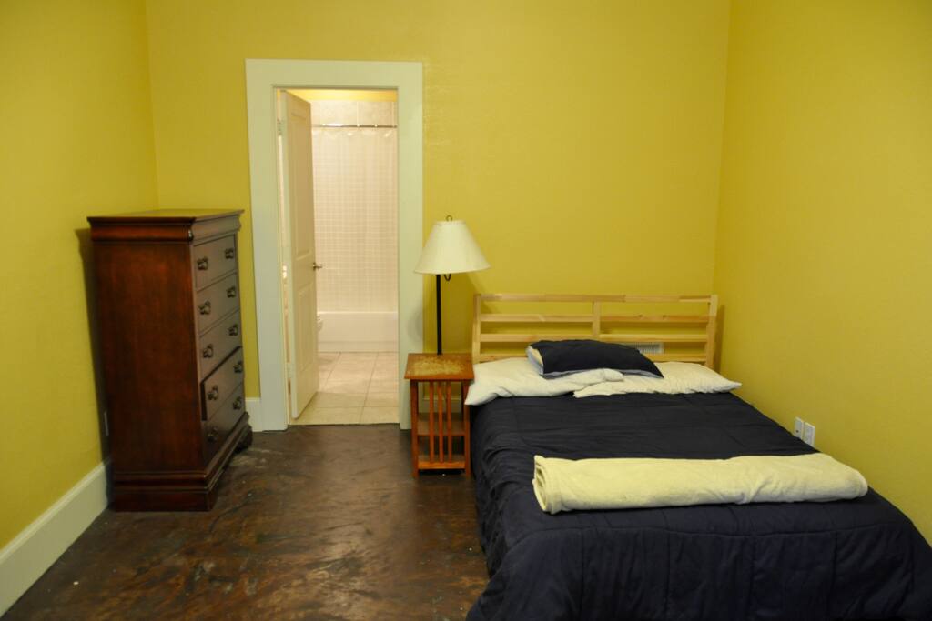 First-floor guest room with en-suite full bathroom and walk-in closet.