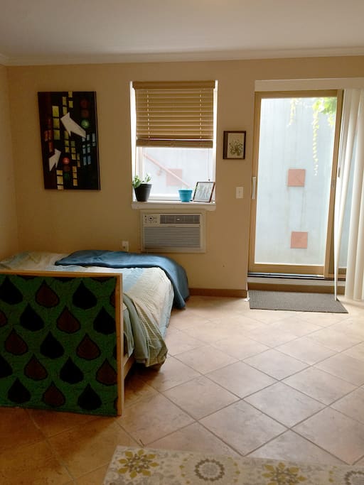 Queen sized, memory foam bed. Window and sliding door (with access to private yard) both equipped with blinds for sleeping and privacy.