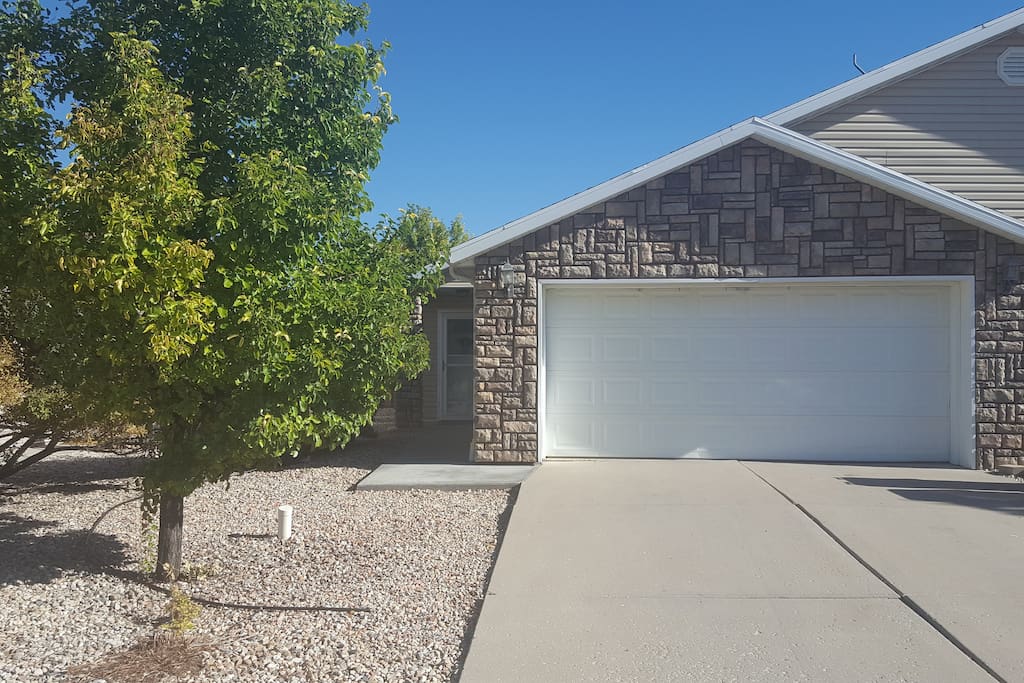 View of the front door and garage.