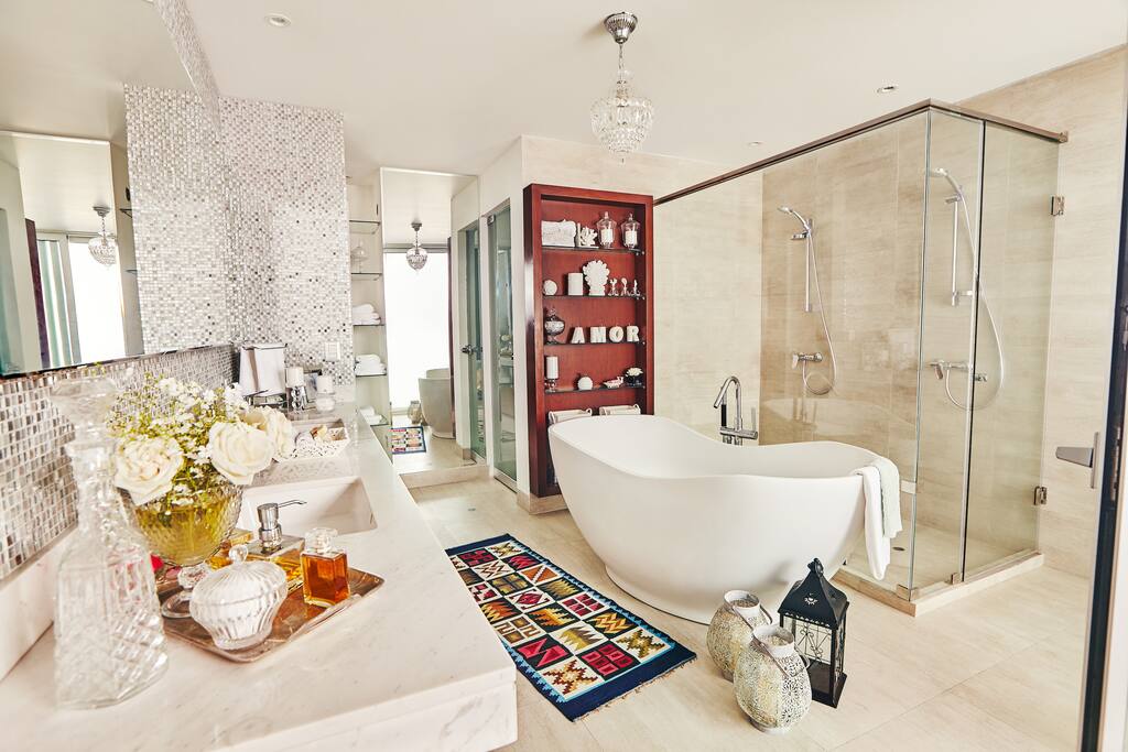 the master bathroom with modern bathtub.