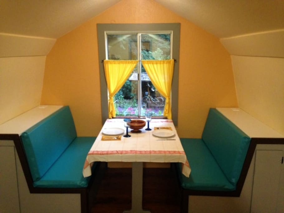 The built-in booth overlooks the yard, gardens and surrounding redwoods