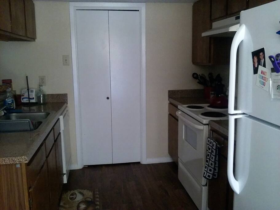 Kitchen with oven, microwave, toaster, fridge, dishwasher, disposal and coffee maker!