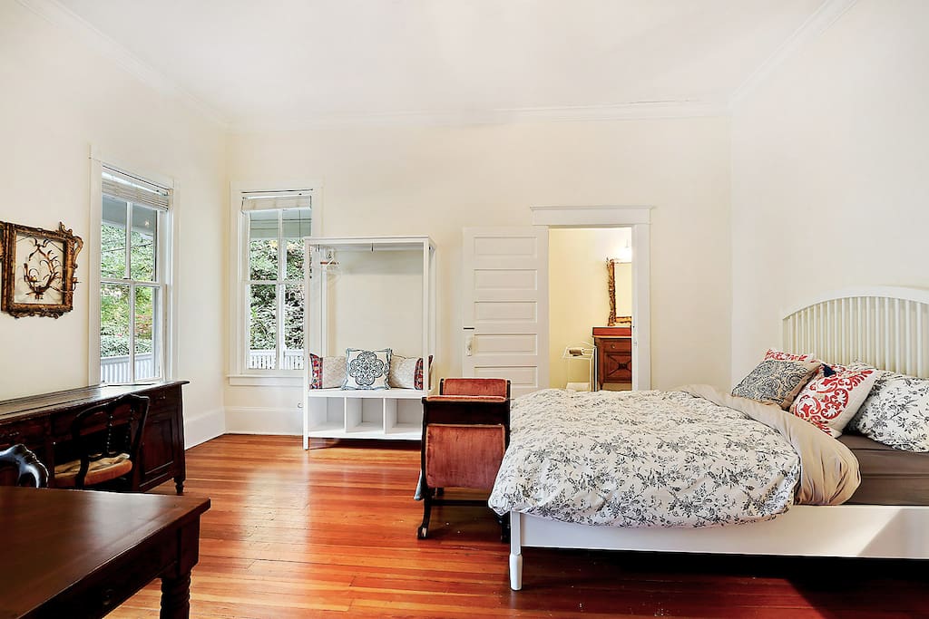 Large bedroom with original 19th c heart pine floors and restored Victorian details