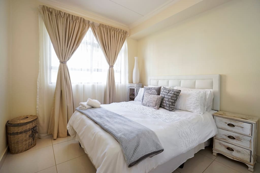 Main bedroom with a quality queen sized bed