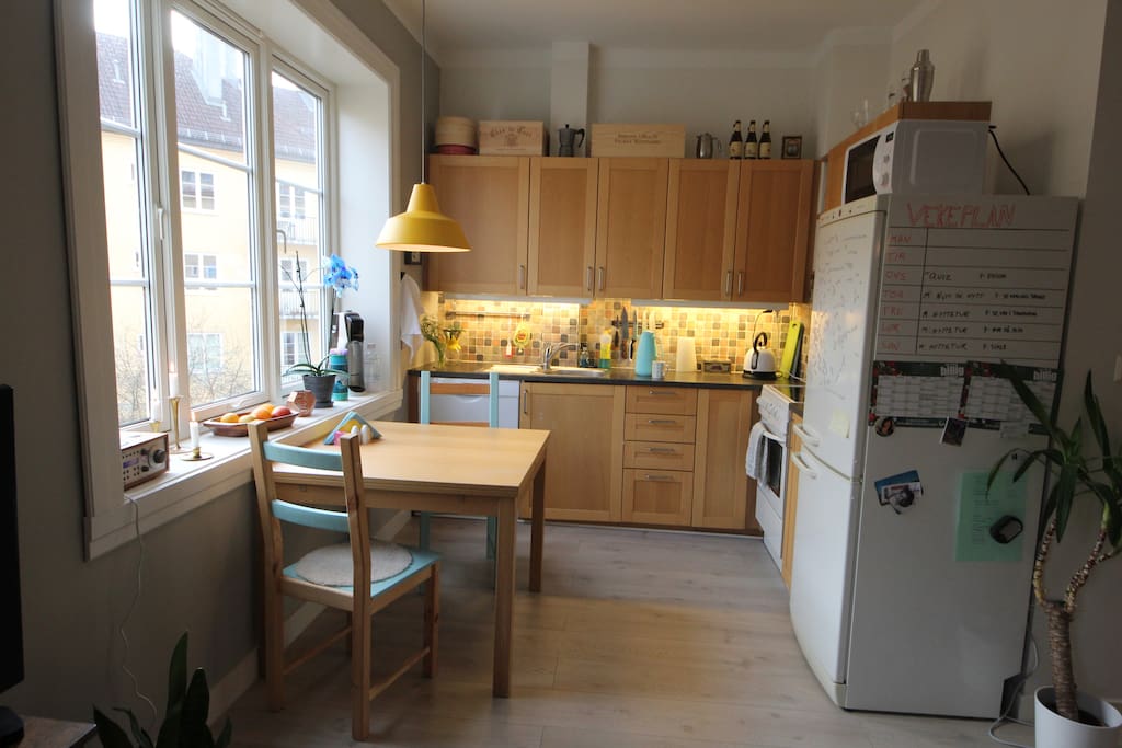 Kitchen with dishwasher, microwave oven, soda streamer and coffee maker.