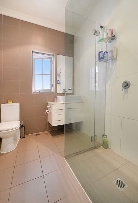 Bathroom with adjoining laundry facilities.