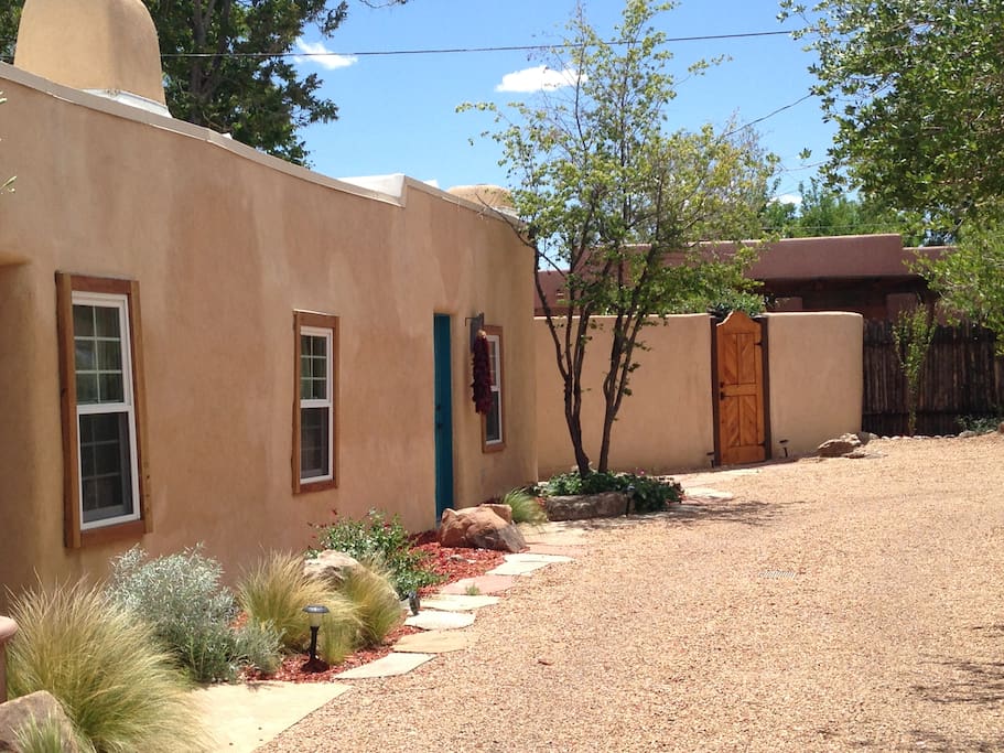 View toward #3 casita (blue door) next to private patio with hot tub (wooden door)