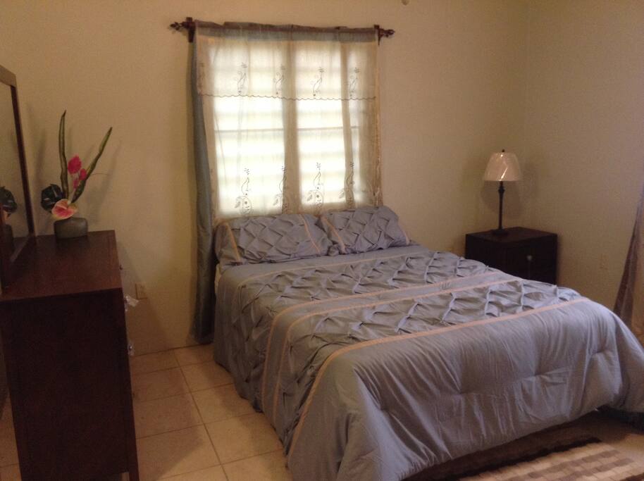 Comfortable Queen- sized bed, dresser and night stand.