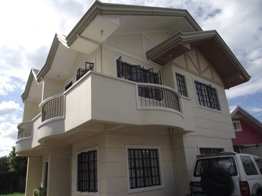The upstairs balcony room benefits from cooling breezes from Sampaloc Lake.