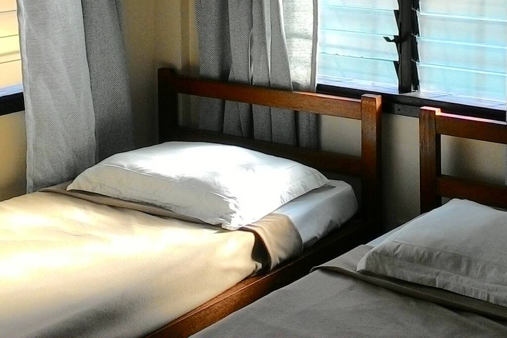 Two single beds placed together make up a king-size bed that sleeps 3.