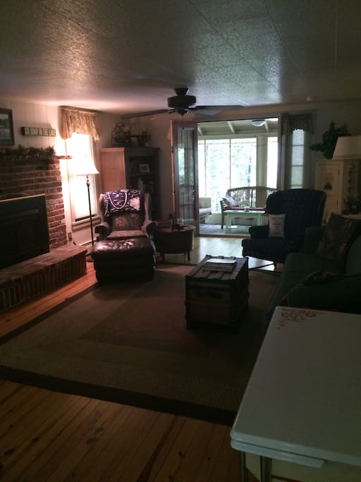 Living room with TV and fireplace