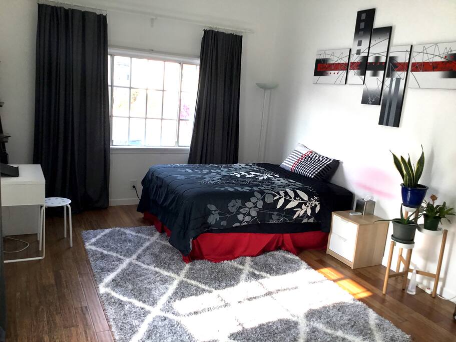 Private room with a queen bed and plush mattress.