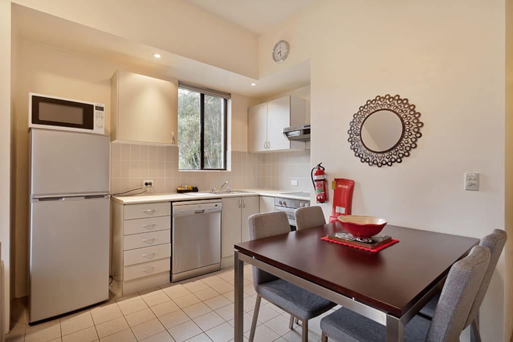 Full Kitchen and a comfy dining setting