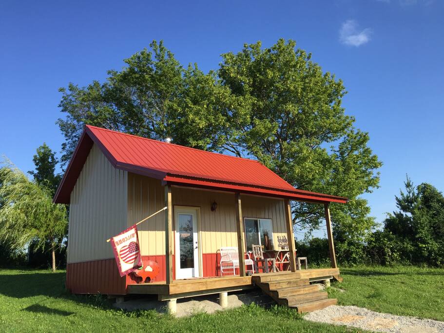 The llama guest house with a covered deck for relaxing.