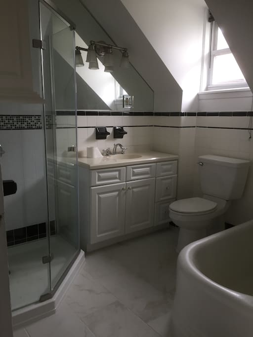 Large bathroom with shower and soaker tub.