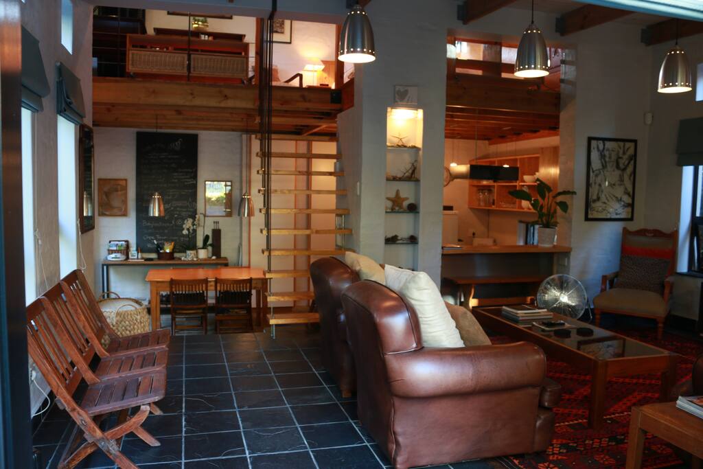 Space on entering cottage - lounge / double volume area - loft above and dining and kitchen area below