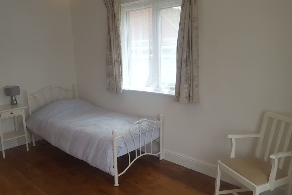 Single bed with brand new matress protector, quilt and pillows.