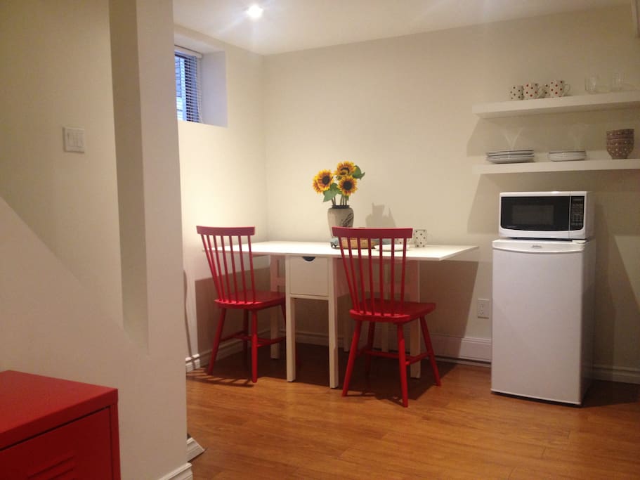 Mini fridge, microwave and dishes for your complimentary continental breakfast or a hot drink.