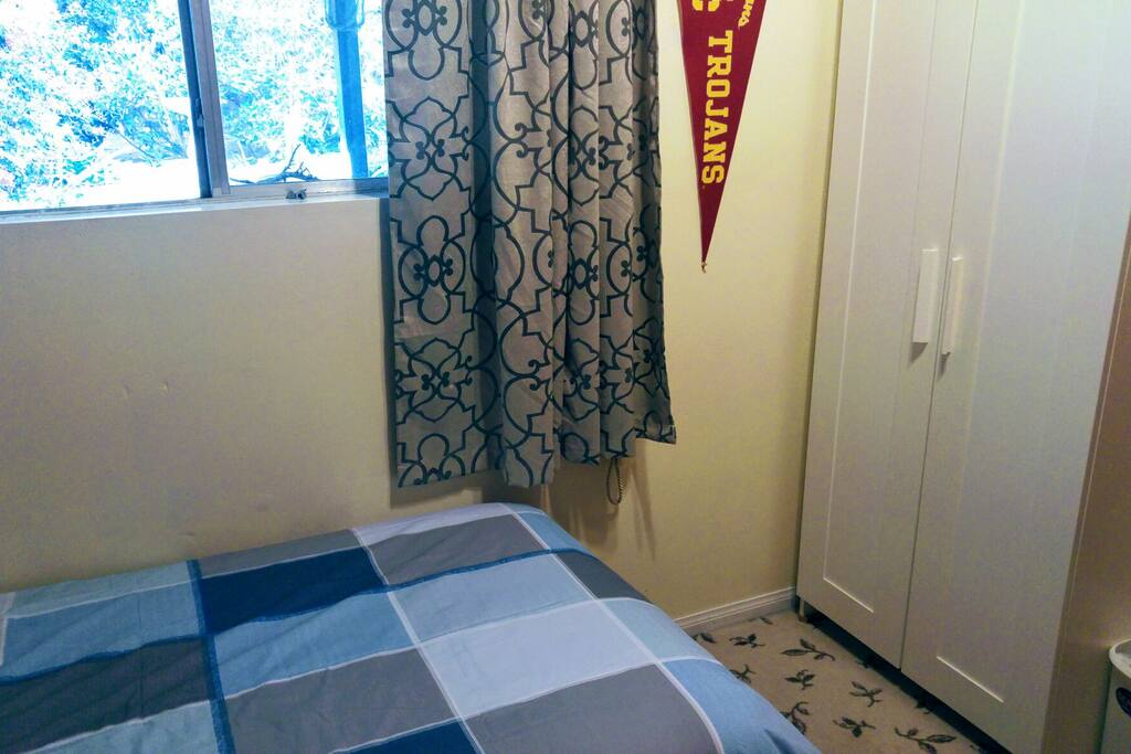 bed room with armoire